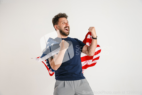 Image of Young man with the flag of United States of America