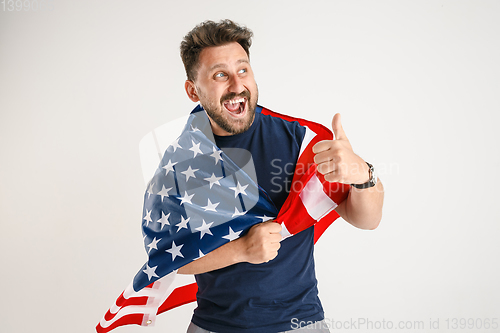 Image of Young man with the flag of United States of America