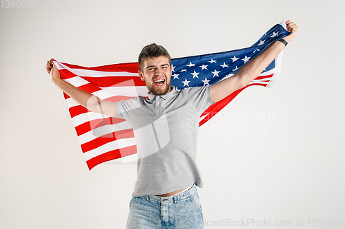 Image of Young man with the flag of United States of America