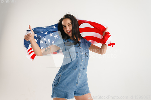 Image of Young woman with the flag of United States of America