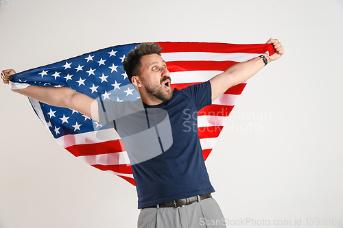 Image of Young man with the flag of United States of America