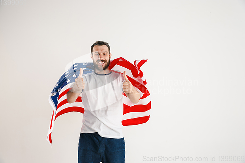 Image of Young man with the flag of United States of America