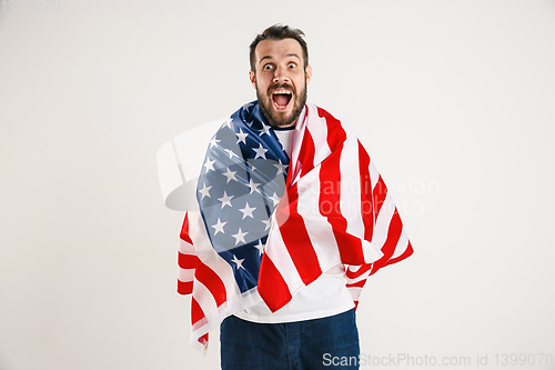 Image of Young man with the flag of United States of America