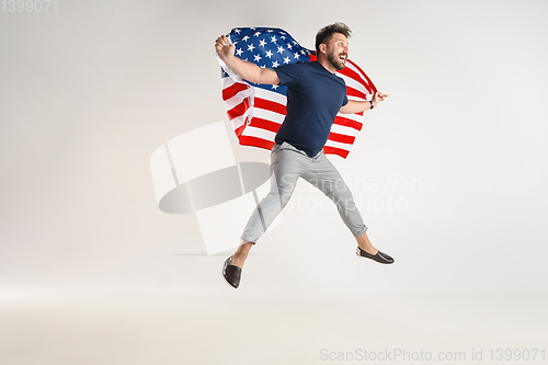 Image of Young man with the flag of United States of America