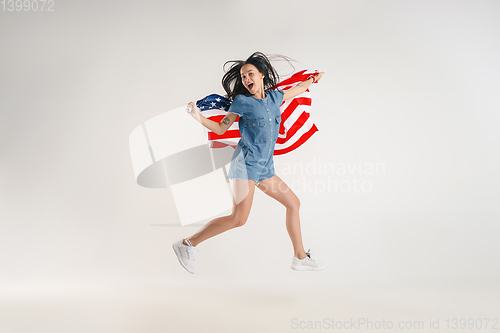 Image of Young woman with the flag of United States of America