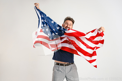 Image of Young man with the flag of United States of America