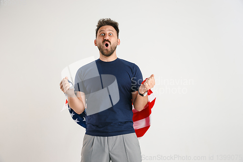 Image of Young man with the flag of United States of America