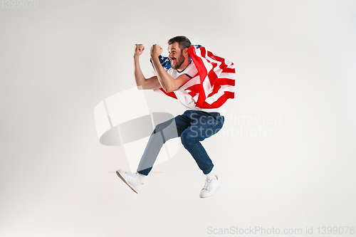 Image of Young man with the flag of United States of America