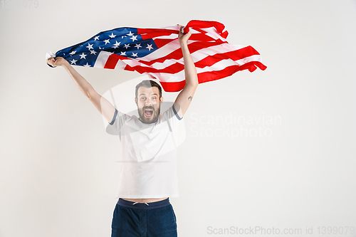 Image of Young man with the flag of United States of America