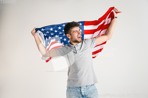 Image of Young man with the flag of United States of America