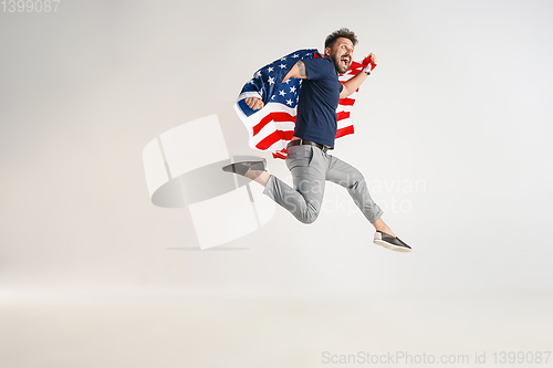 Image of Young man with the flag of United States of America