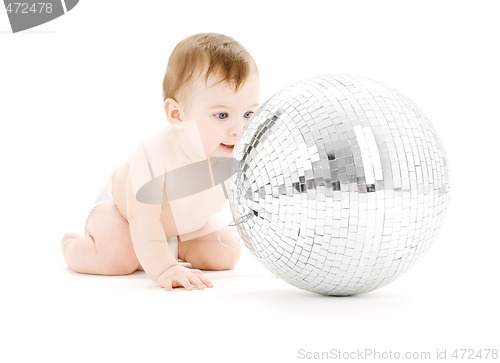 Image of adorable baby boy with big disco ball