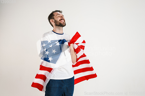 Image of Young man with the flag of United States of America