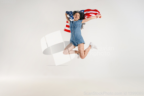 Image of Young woman with the flag of United States of America