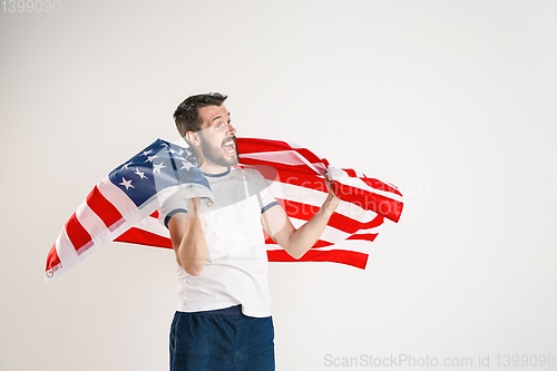 Image of Young man with the flag of United States of America