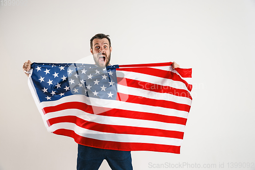 Image of Young man with the flag of United States of America