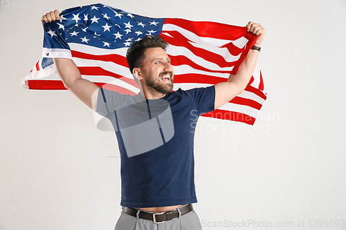 Image of Young man with the flag of United States of America