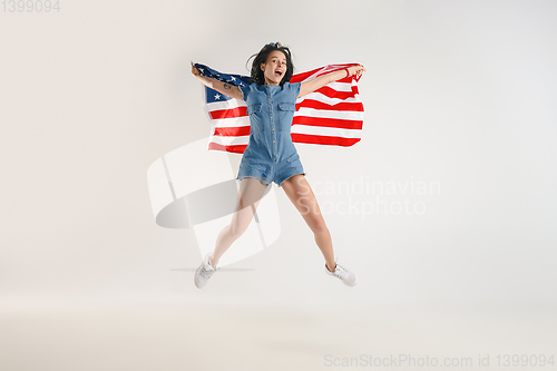 Image of Young woman with the flag of United States of America