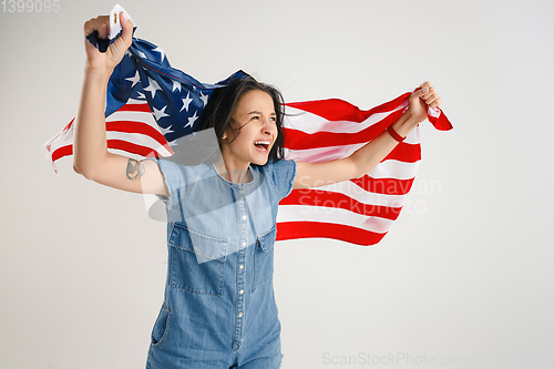 Image of Young woman with the flag of United States of America