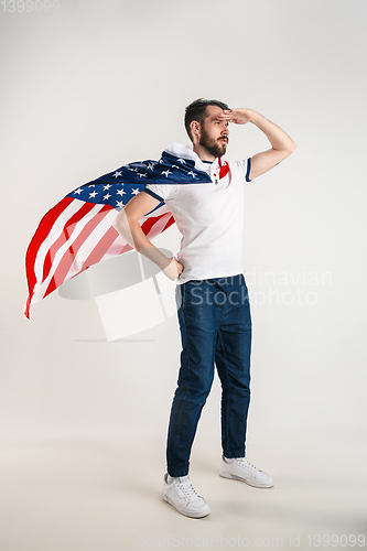 Image of Young man with the flag of United States of America