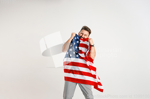 Image of Young man with the flag of United States of America