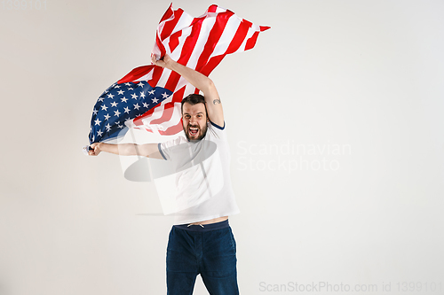 Image of Young man with the flag of United States of America