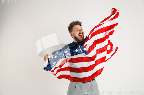 Image of Young man with the flag of United States of America