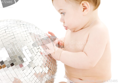 Image of adorable baby boy with big disco ball