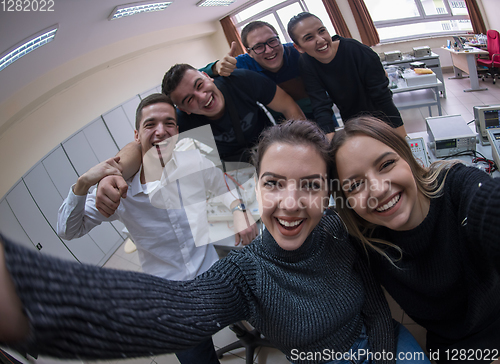 Image of young happy students doing selfie picture