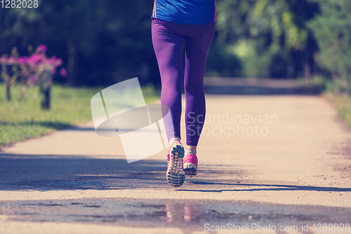 Image of young female runner training for marathon