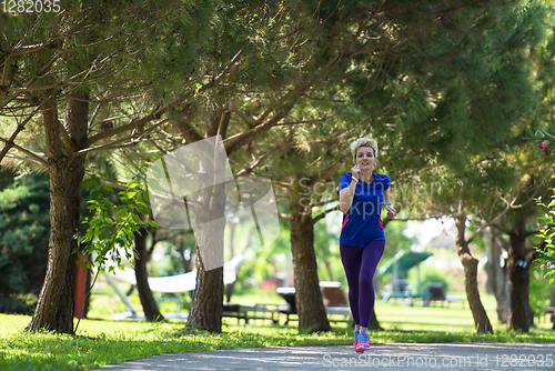 Image of young female runner training for marathon