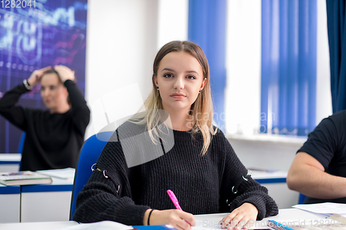 Image of female student writing notes