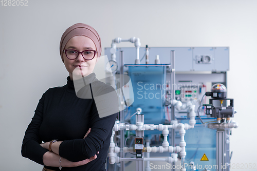 Image of portrait of muslim female student in the electronic classroom