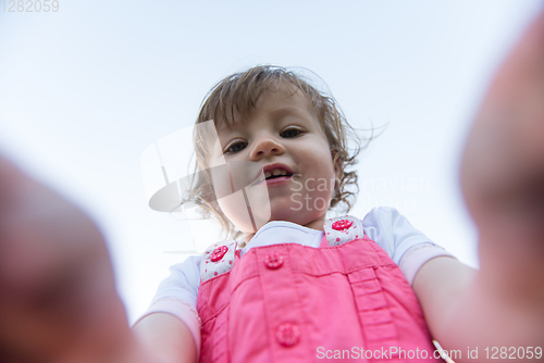 Image of little girl spending time at backyard