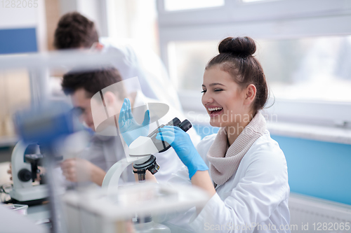 Image of Group of young medical students doing research