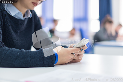 Image of female student using a mobile phone