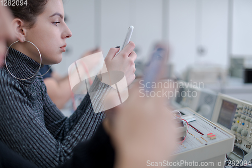 Image of female student using a mobile phone