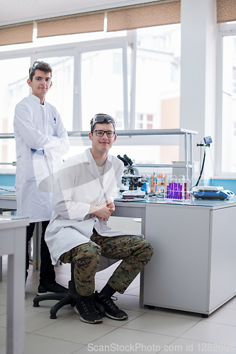 Image of Group of young medical students doing research