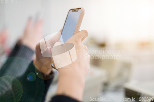 Image of female student using a mobile phone