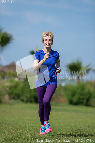 Image of young female runner training for marathon