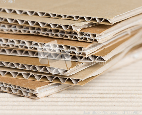 Image of Cardboard pile on corrugated background