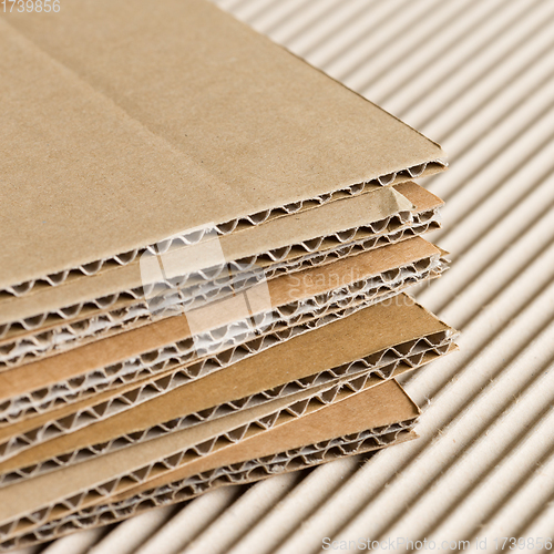 Image of Cardboard pile on corrugated background