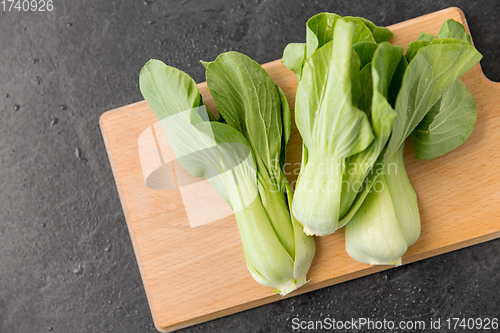 Image of bok choy chinese cabbage on wooden cutting board