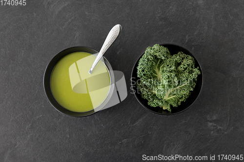 Image of kale cabbage cream soup in bowl with spoon