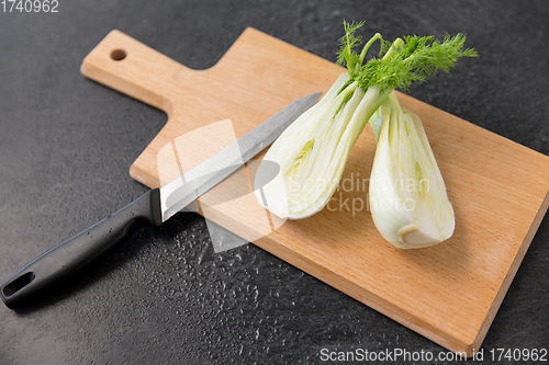 Image of fennel and kitchen knife on wooden cutting board