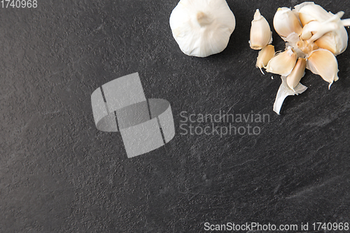 Image of garlic on slate stone background