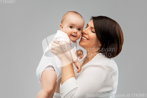 Image of happy middle-aged mother with little baby daughter