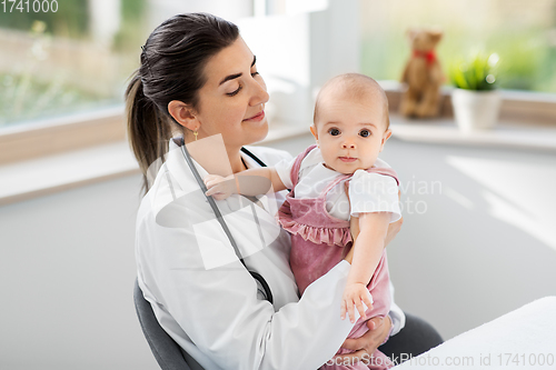 Image of female pediatrician doctor with baby at clinic