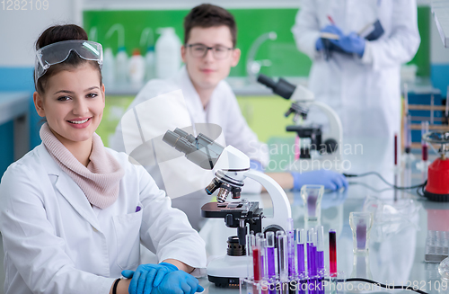 Image of Group of young medical students doing research