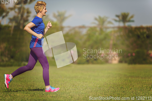 Image of young female runner training for marathon